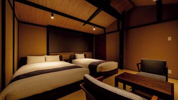 Junior Suite, Garden View | 2 bedrooms, in-room safe, desk, blackout drapes