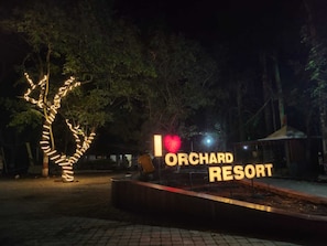A sign for Orchard Resort with a heart symbol and the words "I ♥ ORCHARD RESORT" in illuminated letters. - Orchard Resort By Vaishali (Bhor)