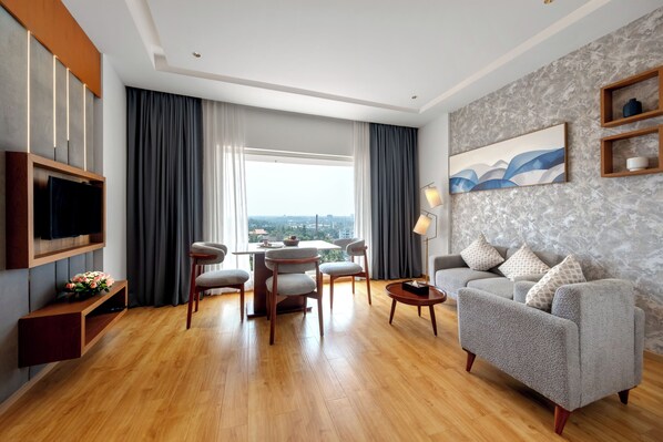 Executive Suite | Living area | 34-inch TV with cable channels - TIARA BY MPS (Kozhikode)