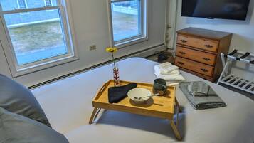 1 bedroom, desk, iron/ironing board, travel crib