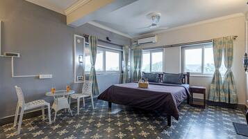 Deluxe Suite, Balcony, Hill View | 1 bedroom, desk, laptop workspace, soundproofing