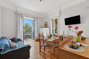 Family Apartment, Multiple Bedrooms, 2 Bathrooms (Sunny House Spiagge e Ciclabile) | Living area | Flat-screen TV