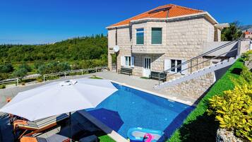 Seasonal outdoor pool, pool umbrellas, pool loungers