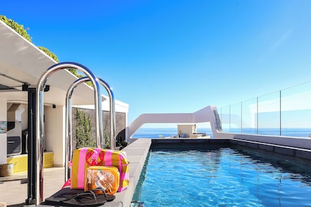 Outdoor pool, open 8:00 AM to 8:00 PM, sun loungers