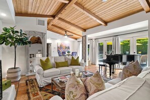 TV, fireplace - Good Vibes Only – Historic Spanish Hacienda with Pool, Spa, Fire Pit & Mountain Views (Palm Springs)