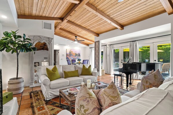 TV, fireplace - Good Vibes Only – Historic Spanish Hacienda with Pool, Spa, Fire Pit & Mountain Views (Palm Springs)