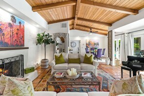 TV, fireplace - Good Vibes Only – Historic Spanish Hacienda with Pool, Spa, Fire Pit & Mountain Views (Palm Springs)