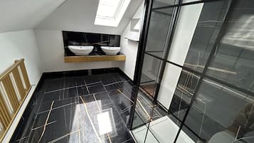 Shower, towels, soap, toilet paper