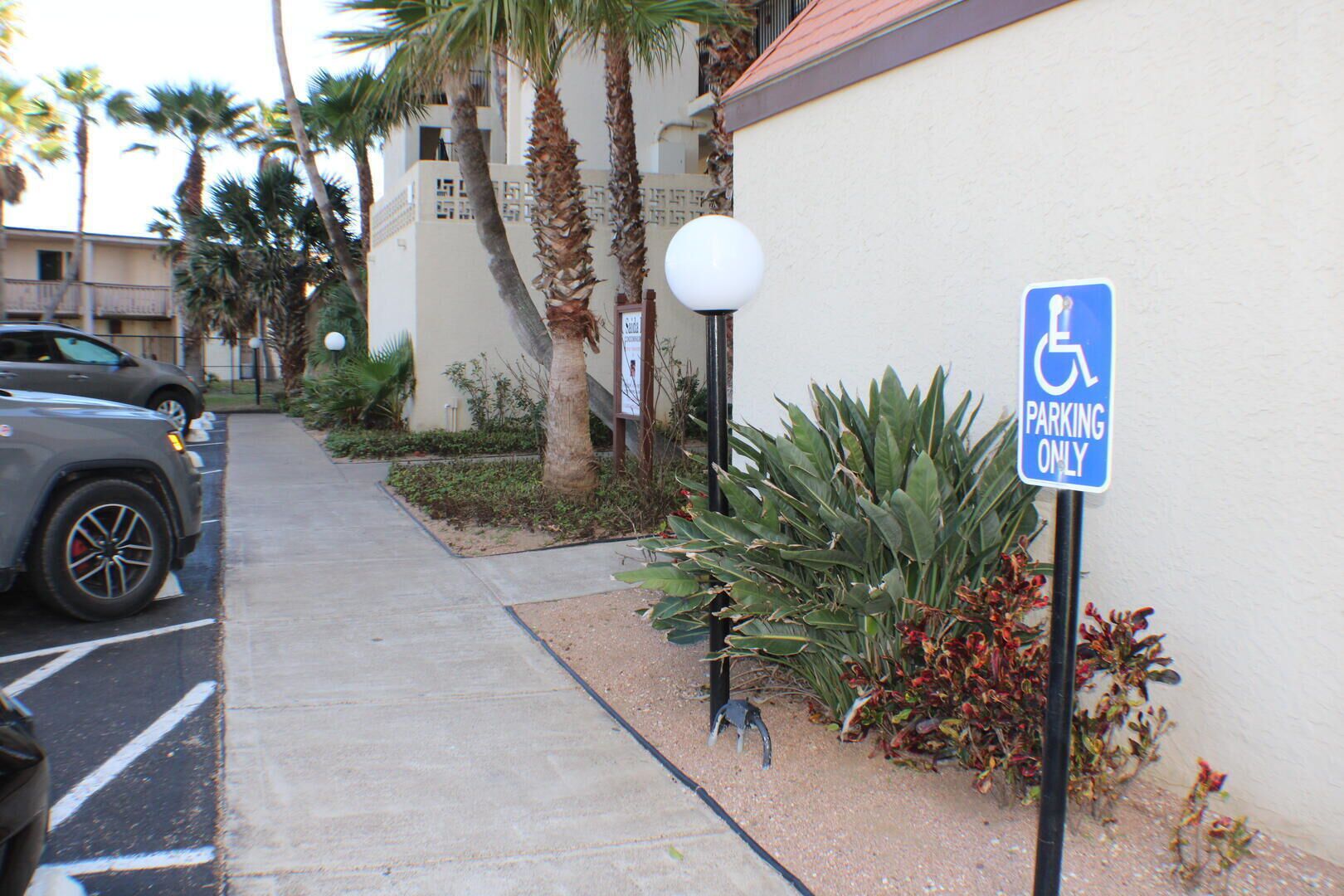A parking area with a sign indicating it is reserved for disabled parking.