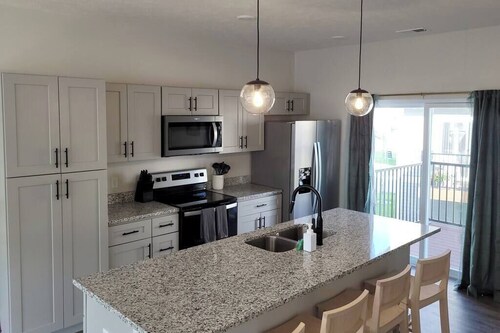 Modern Omaha Getaway with Private Deck & Free Parking