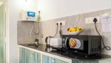 Fridge, electric kettle, cookware/dishes/utensils