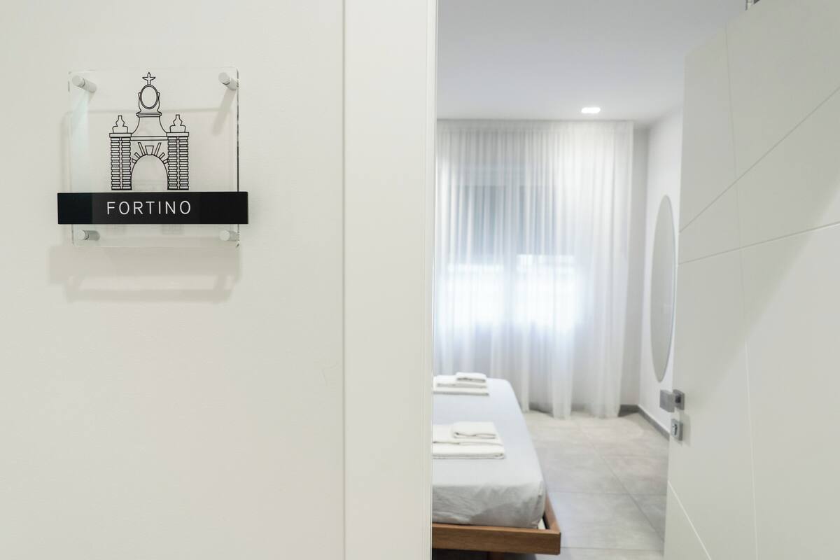 Premium bedding, pillow-top beds, desk, laptop workspace