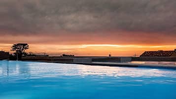 10 indoor pools, outdoor pool, open 7:00 AM to 10:00 PM, pool umbrellas