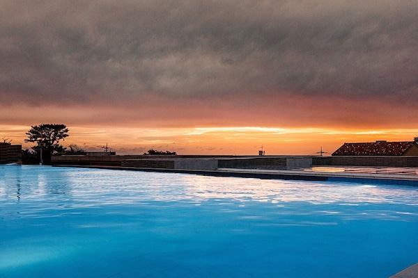 10 indoor pools, outdoor pool, open 7:00 AM to 10:00 PM, pool umbrellas