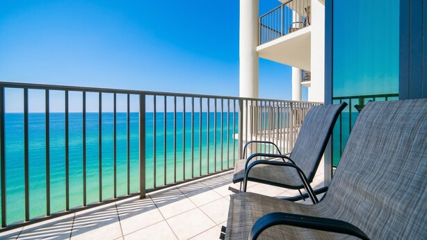 A balcony with a view of the ocean, a tiled floor, and a railing. - The Oasis 2708 Formerly Phoenix West Ii 2708 3 Bedroom Condo by RedAwning (Orange Beach)