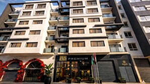 A multi-story hotel with a modern facade, balconies, and a storefront labeled 'AS PREMIUM'. - AS PREMIUM BY SOHO HOTELS (Casablanca)