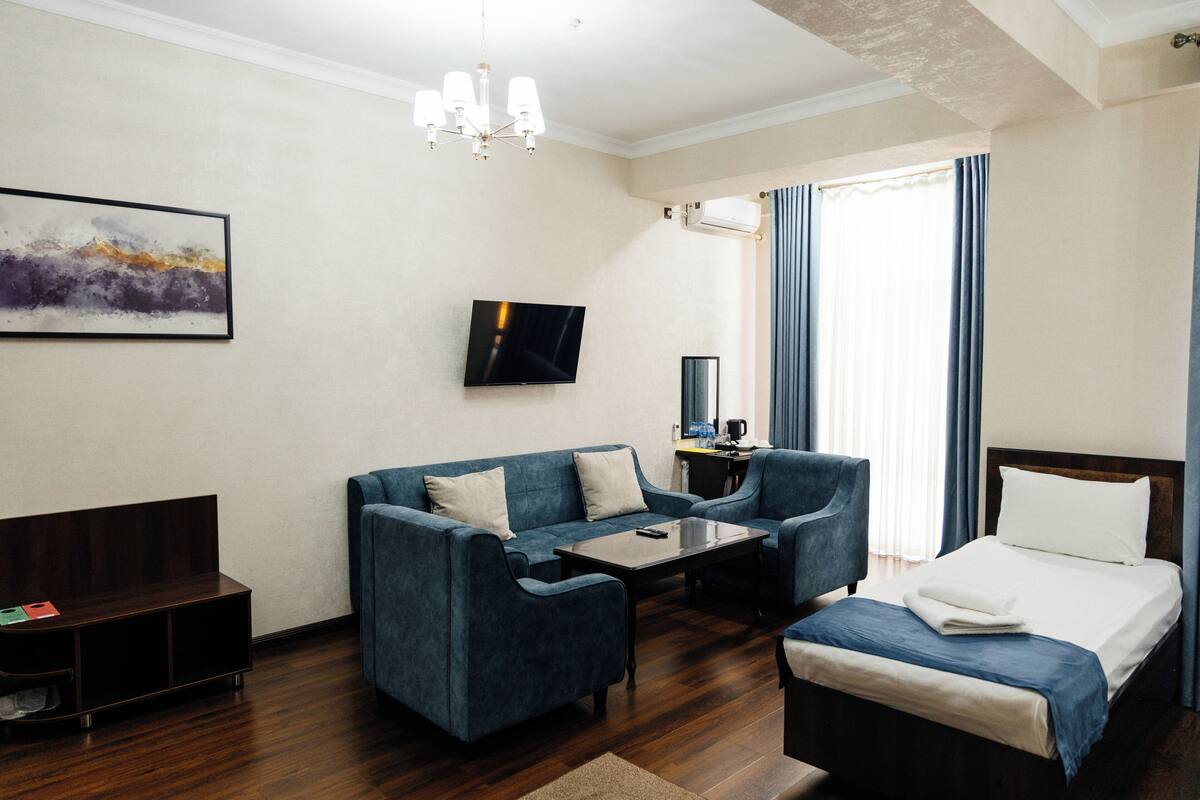 Comfort Triple Room | Select Comfort beds, desk, laptop workspace, blackout drapes
