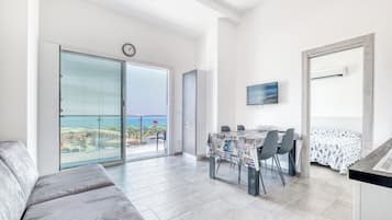 Family Apartment, Multiple Bedrooms, Sea Facing (Le Lanterne 1 - Luxury Apartments) | Living area | 21-inch flat-screen TV with cable channels, TV