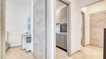 Family Apartment, Multiple Bedrooms, Sea Facing (Le Lanterne 3 Luxury Apartments) | Private kitchen | Fridge, oven, stovetop, coffee/tea maker