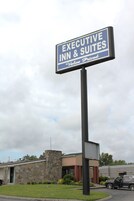 A sign for Executive Inn & Suites advertising value-priced accommodations.