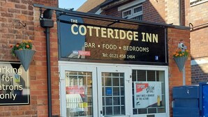 The Cotteridge Inn with a signboard advertising a bar, food, and bedrooms. - The Cotteridge Inn (Birmingham)
