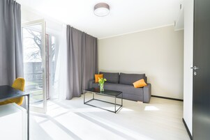 Family Room, City View | Desk, laptop workspace, blackout drapes, iron/ironing board