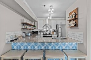 Fridge, microwave, oven, stovetop - Stylish 2-bedroom waterfront condo in beautiful Carolina Beach (Carolina Beach)