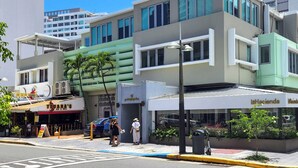 A modern building with a restaurant named 'Tiuana's' and a hotel named 'La Hacienda'. - New! Penthouse Studio C in heart of Condado (San Juan)