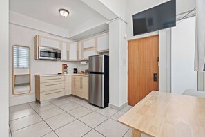 Fridge, microwave, stovetop, coffee/tea maker