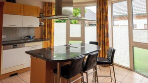 Coffee/tea maker, fridge, microwave, oven