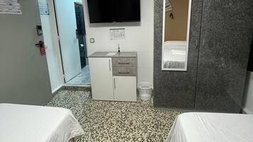 1 dormitori i roba de llit