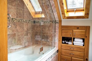 Jetted tub, hair dryer, towels, soap