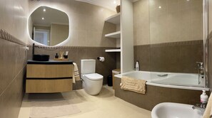 Shower, hair dryer, bidet, towels