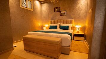 Deluxe Suite, Garden View | Individually decorated, individually furnished, desk, free WiFi