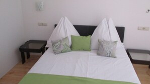 A bedroom with a bed, two nightstands, and a wall socket. - Guest House Villa Daniel - Two Bedroom Apartment with Balcony (Omis)
