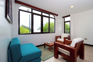 Deluxe Apartment, Private Bathroom, Sea View | Living area | 42-inch Smart TV with cable channels