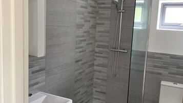 Shower, hair dryer, towels, soap