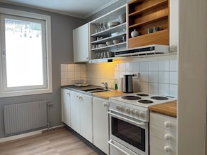 Apartemen Superior | Dapur pribadi | Lemari es, microwave, oven, dan kompor