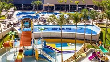 A water park with multiple pools, slides, and a children's play area.