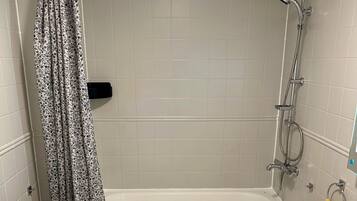 Shower, hair dryer, towels, toilet paper