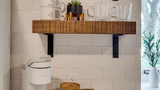 A kitchen with a coffee maker, a basket of coffee beans, and a sign that says "COFFEE". - Your Peaceful Minnetonka Home Base • Comfortable, Cozy & Conveniently Located (Minnetonka)