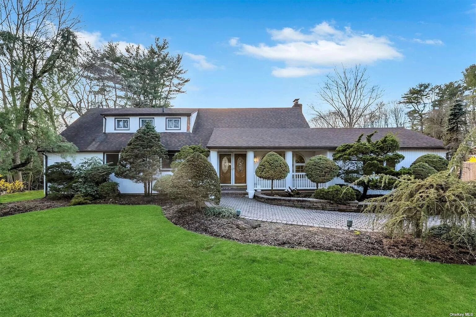 Spacious 6-bedroom house centrally located with pool in charming Dix Hills.