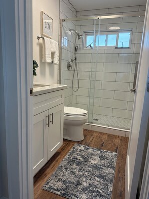Shower, hair dryer, towels, soap