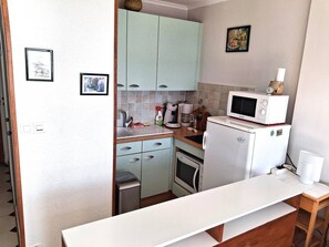 Fridge, microwave, cookware/dishes/utensils