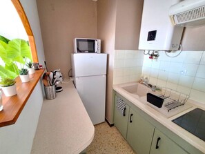 Fridge, microwave, cookware/dishes/utensils