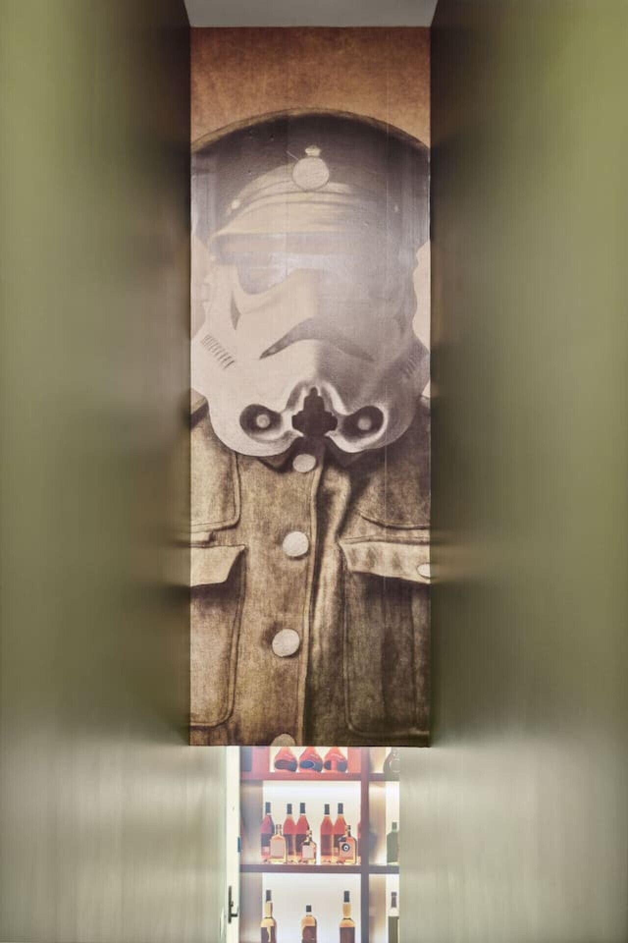 A mural of a figure in a military uniform with a helmet and goggles.