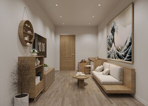 A modern living room with a wooden sofa, a coffee table, and a large painting on the wall. - Nature Hotel (Xuan Huong - Da Lat)