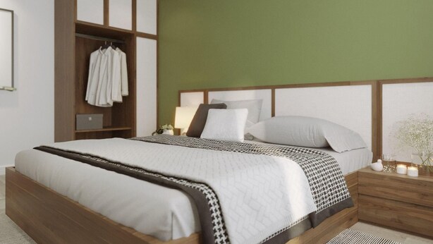 Une chambre à coucher moderne, avec un lit, une armoire et une table de chevet.