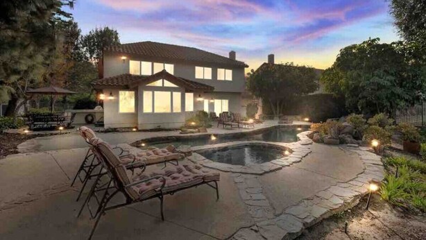 A two-story house with a swimming pool, outdoor seating, and a patio area. - Secluded Romantic Getaway with Stunning NatureView (Anaheim)