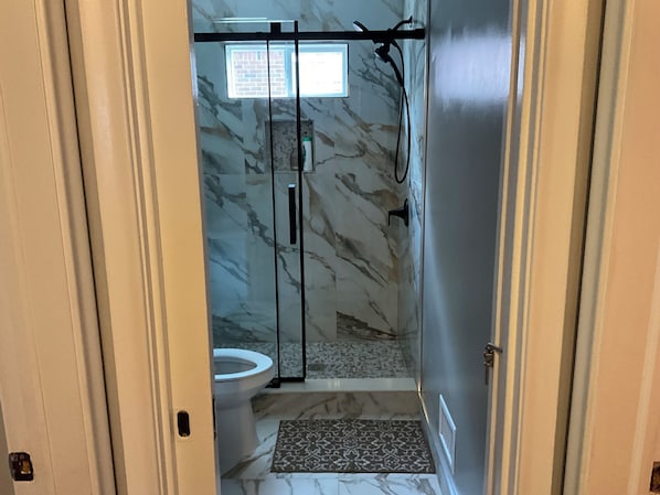 Shower, hair dryer, towels, soap